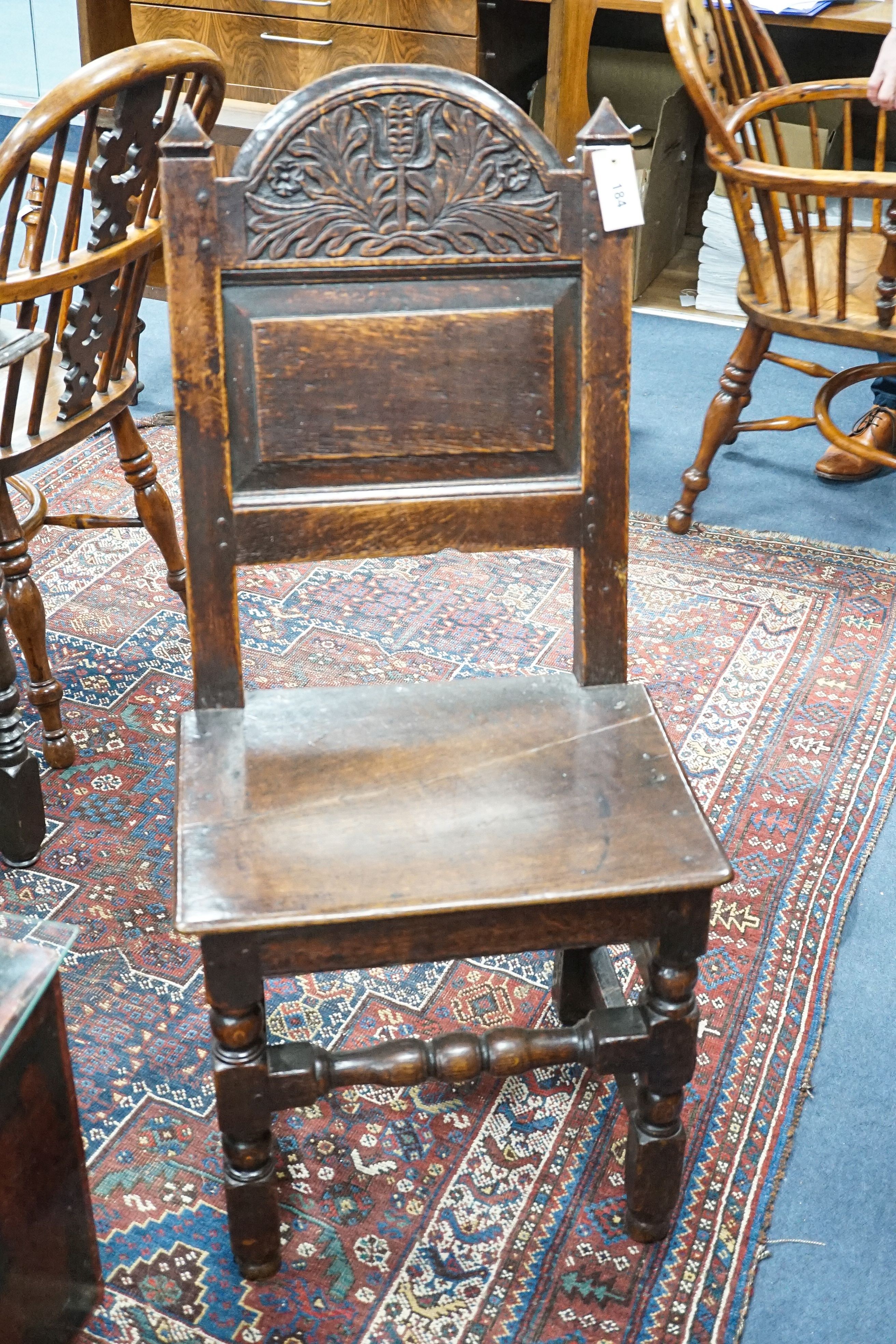 A 17th century Lancashire carved oak side chair, width 47cm, depth 36cm, height 104cm
